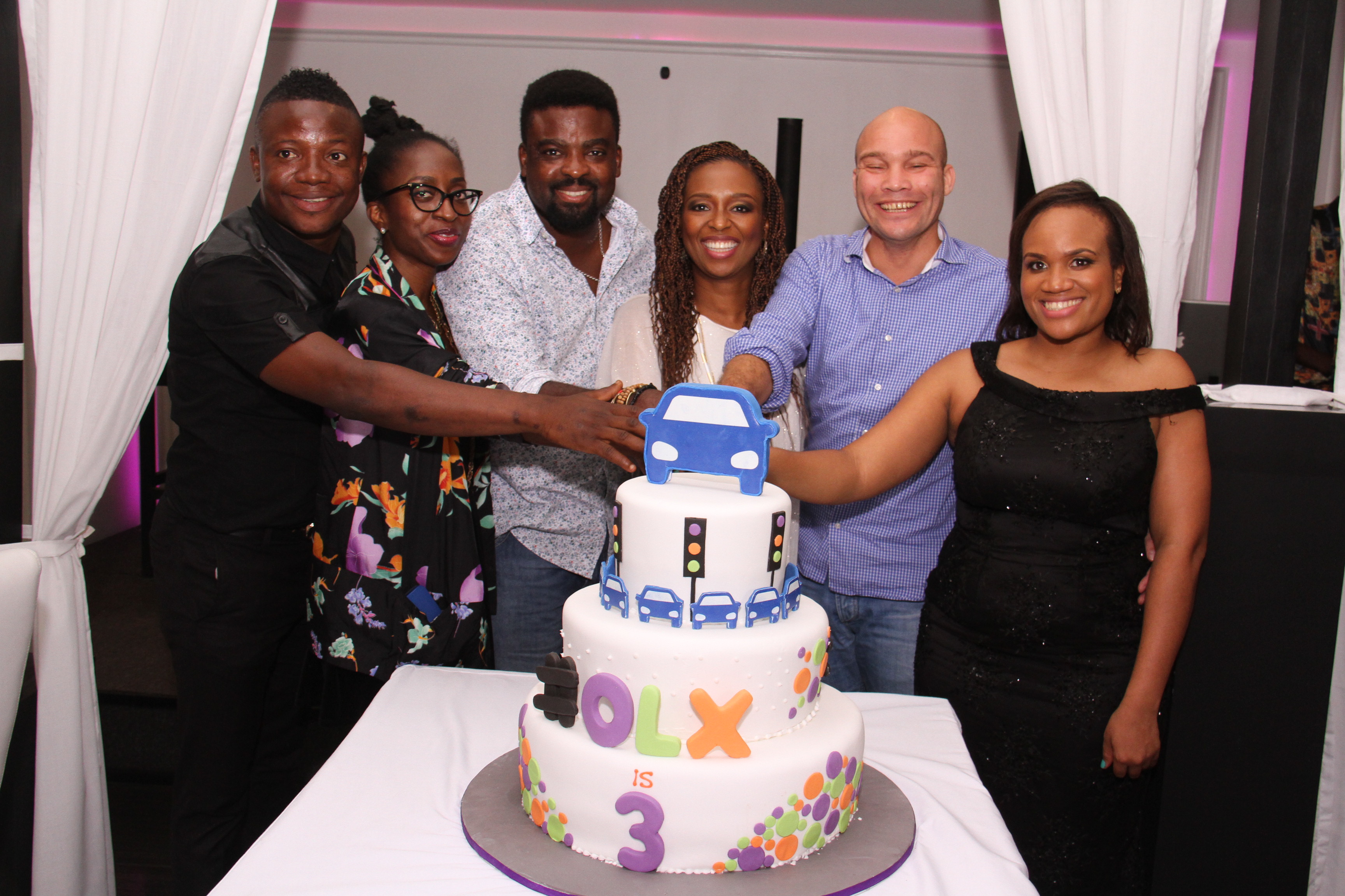L-R Bash, Comedian & MC; Fife Aiyesimoju; Brand Marketing Manager, OLX; Kunle Afolayan; Nollywood Actor and Film Director; Lola Masha, Country Manager; OLX; Arthur Dieffenthaler; Commercial Director, Air France and Uche Nwagboso; PR & Communication Manager, OLX cutting the 3rd anniversary cake at the Rooftop Restaurant, VI. 